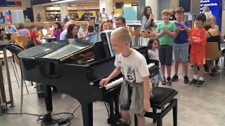 Amazing airport pianist Harrison aged 11 plays Ludovico Einaudi cover Nuvole Bianche [upl. by Longo905]