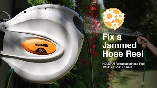 How to Fix a Jammed Holman Retractable Hose Reel [upl. by Oicnevuj559]