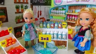 Elsa and Anna toddlers go shopping at the supermarket and buy toys [upl. by Imoen]