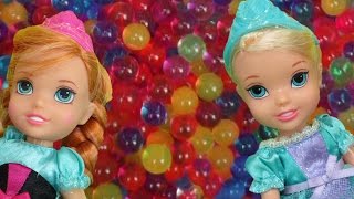 Elsa and Anna toddlers have fun in ORBEEZ  They slide into colorful water beads [upl. by Studley]